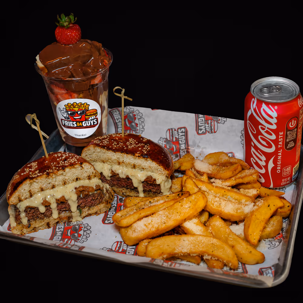 The Blue Royal platter with Dutch-style fries, a branded dessert cup and a Coca-Cola on a metal tray