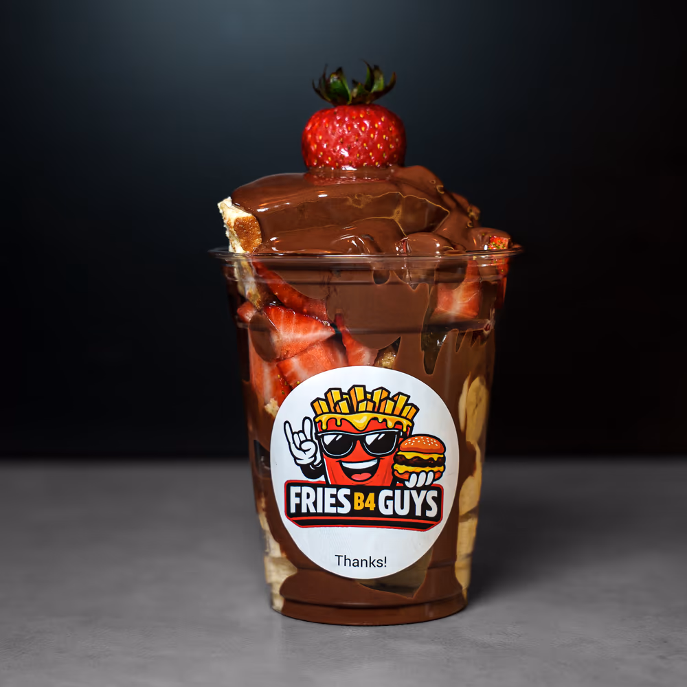 San Sebastian cheesecake cup with strawberries, banana, and Nutella in a branded FRIES B4 GUYS cup