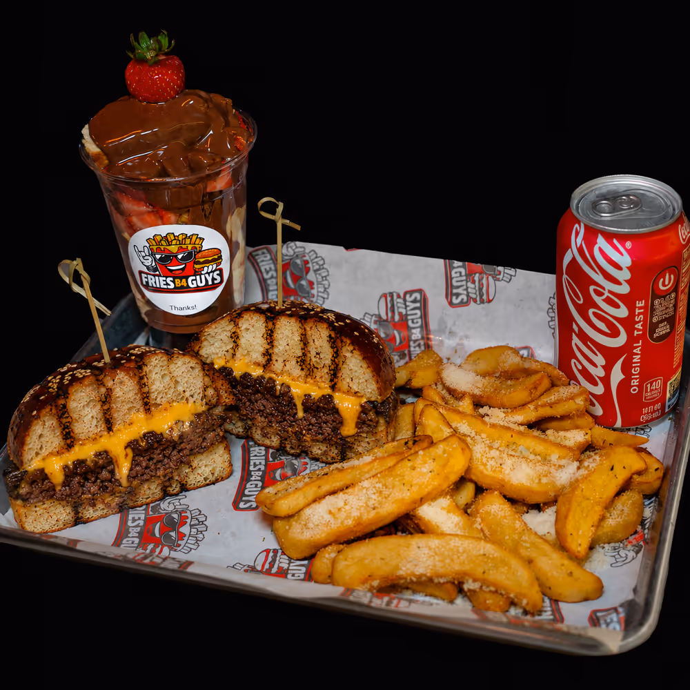 The FBG Burger platter with Dutch-style fries, a branded dessert cup and a Coca-Cola on a metal tray
