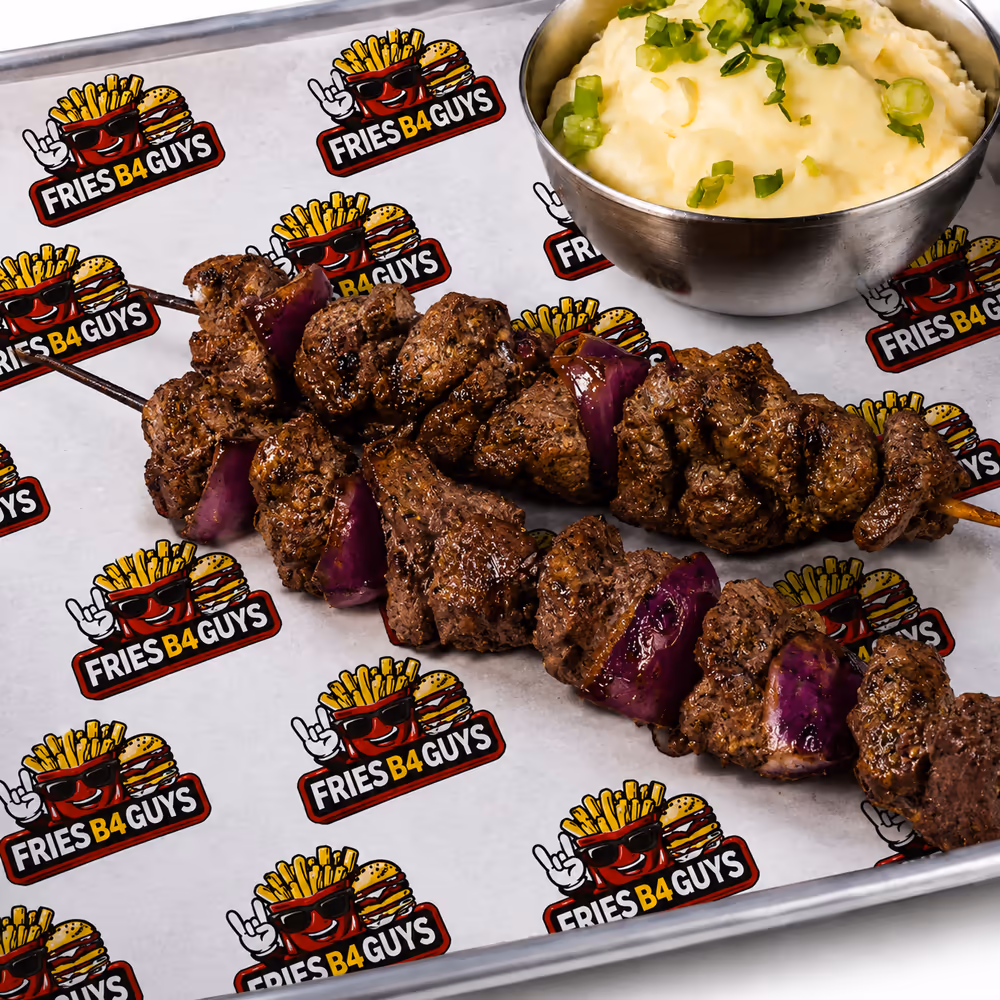 Prime steak skewer combo with two halal picanha skewers and red onion, served with a side of mashed potatoes